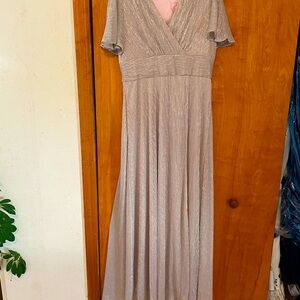 Women’s gown. Flutter sleeve. Gold color